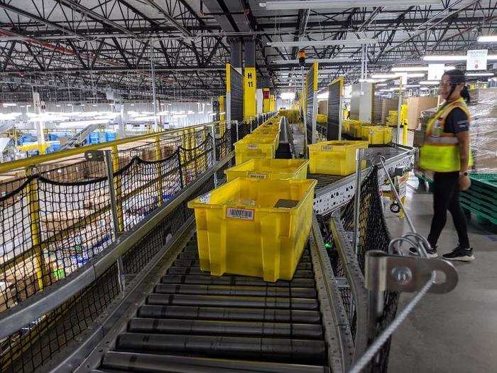 These yellow plastic bins are called "totes" in the fulfillment center — everything that comes in or out of this warehouse must fit within one of these totes. There are over 40,000 such bins in this facility alone.