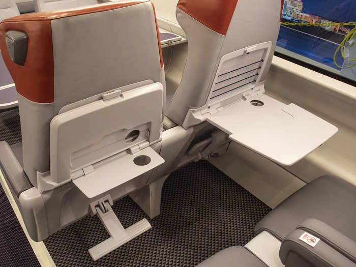 Double tray tables make it easy to customize your seat for working, eating, or anything else.