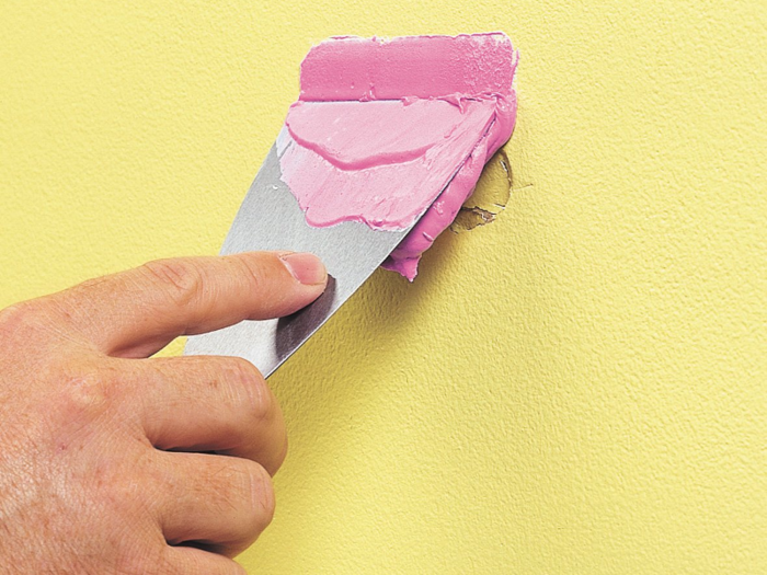 Step 2: Use a putty knife to fill the hole with spackle and let it dry