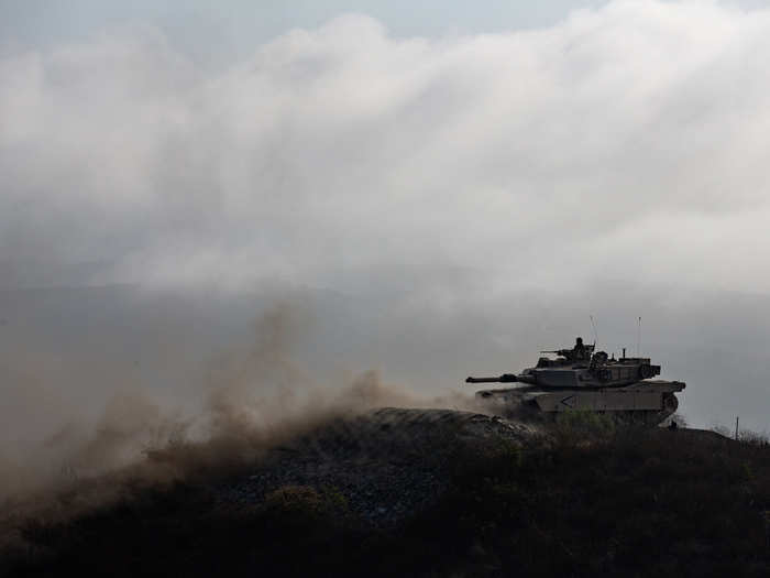 Immediately after, the Marines were handed pieces of tank track. Once they held the chunks of track, the Marines began the 500-meter track shuffle.