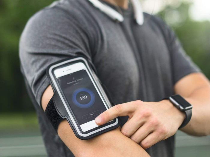 An armband that holds her phone on runs or at the gym