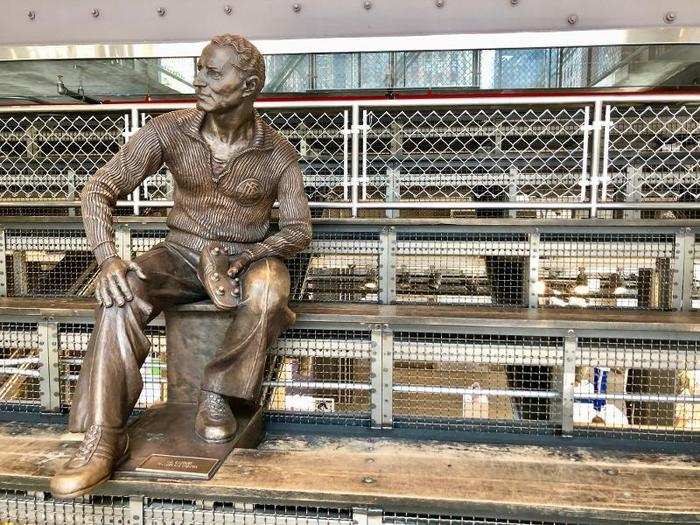 We headed upstairs and were met with this life-size statue of Adi Dassler — the founder of Adidas — hanging out in some bleachers.