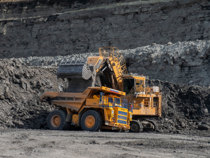 Each excavator bucket holds about 30 tonnes — more than 66,000 pounds — of soil or ore.