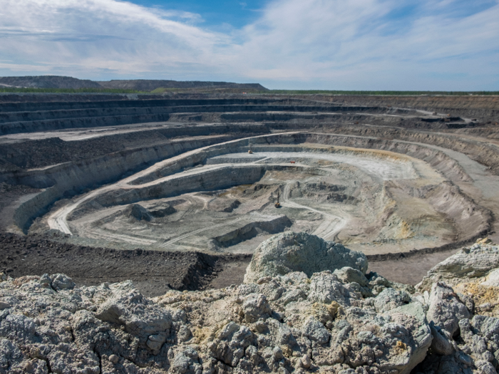 We got out first look at the mine from an observation deck built on one side. The open-pit Botuobinsky mine spirals down about 426 feet, and it