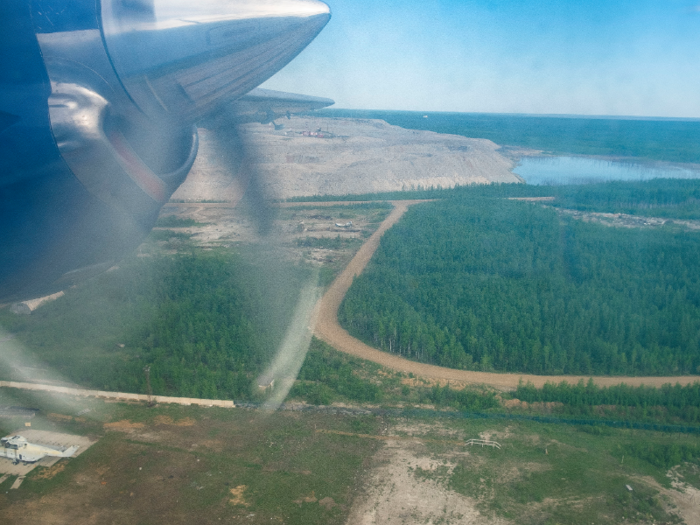 Through the dirty airplane window, I watched as we passed over forests, dirt roads, rivers, and lakes.