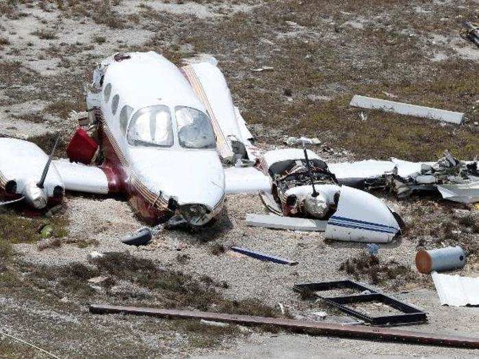 That Piper, although it was catastrophically damaged, was in relatively good shape compared to some other planes, including this one which was split in half on the airfield.