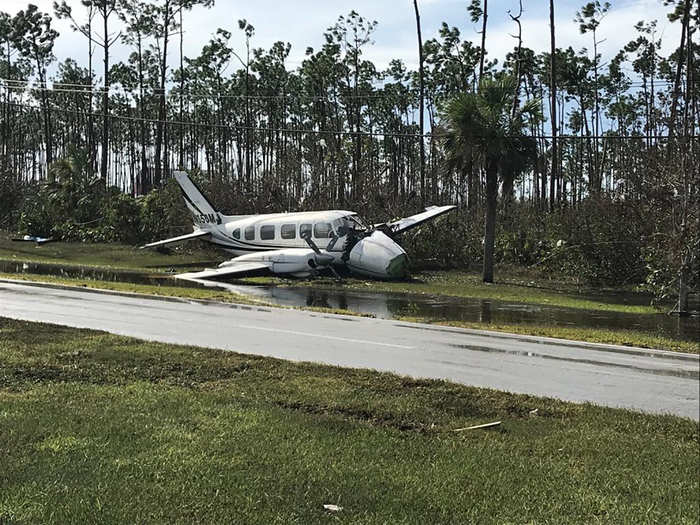 Airplanes, like this Piper PA-31-350 Chieftain, were thrown across the grounds. The damage to the airframe is unmistakable.