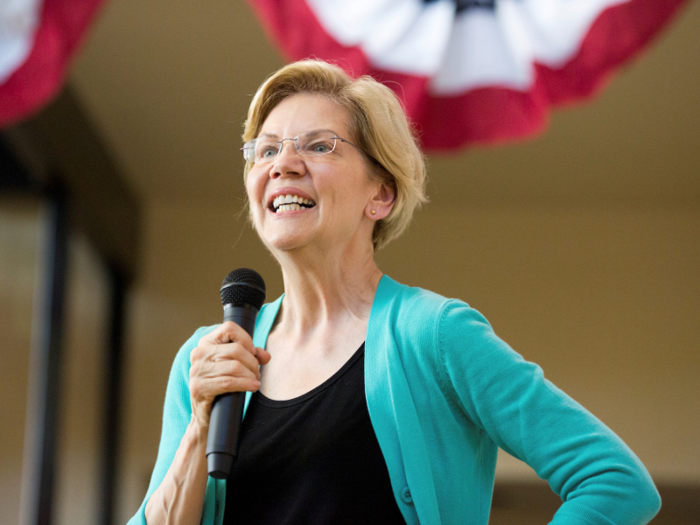"They want to be able to stir up a lot of controversy around your lightbulbs, around your straws, and around your cheeseburgers," Elizabeth Warren said of the fossil-fuel industry.