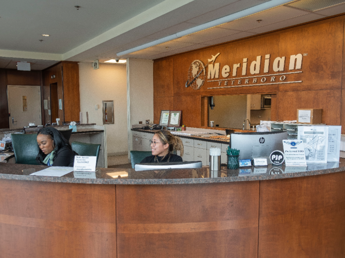 Travelers passing through Meridian Teterboro are personally greeted by the customer service team at the reception desk.