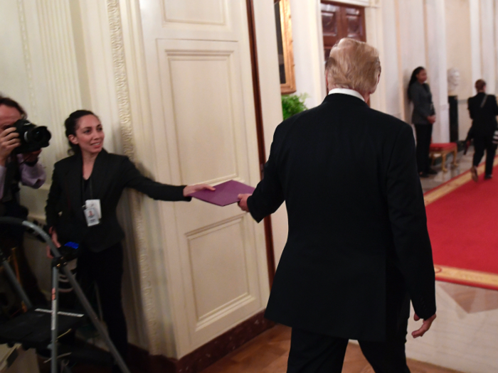 In September 2018, Epoch Times photojournalist Samira Bouaou entered a restricted area of the White house and handed President Trump a folder.