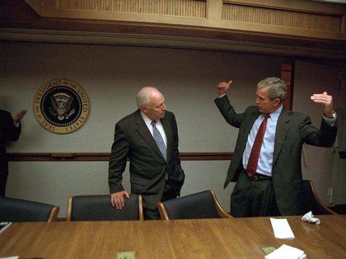 Bush talks with Vice President Dick Cheney in the President