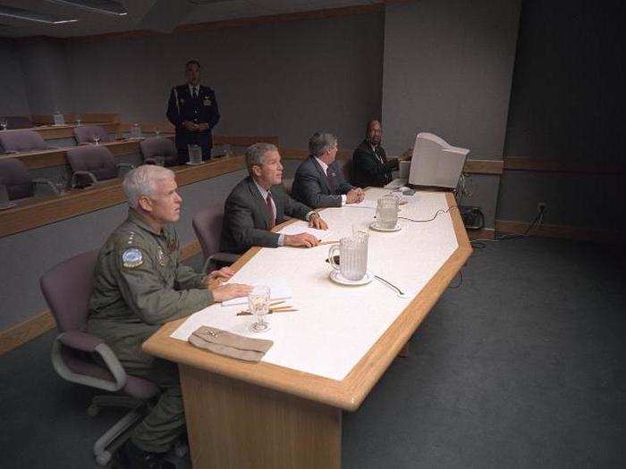 Bush, Admiral Richard Mies, left, and White House Chief of Staff Andy Card conduct a video teleconference at Offutt Air Force Base.