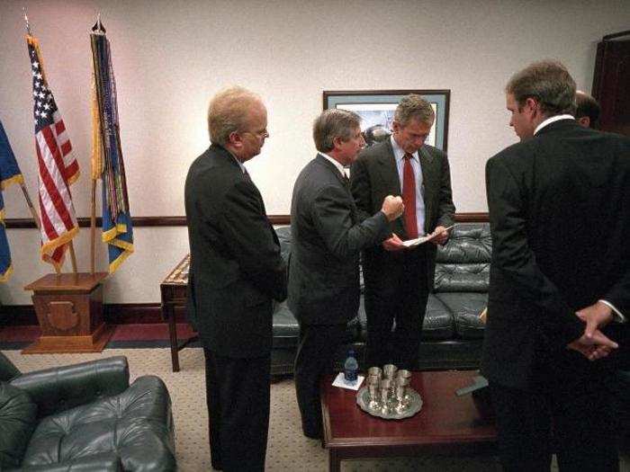 Bush confers with, from left, Karl Rove, Andy Card, Dan Bartlett, and Ari Fleischer before delivering remarks on the World Trade Center disaster from the General Dougherty Conference Center at Barksdale Air Force Base.