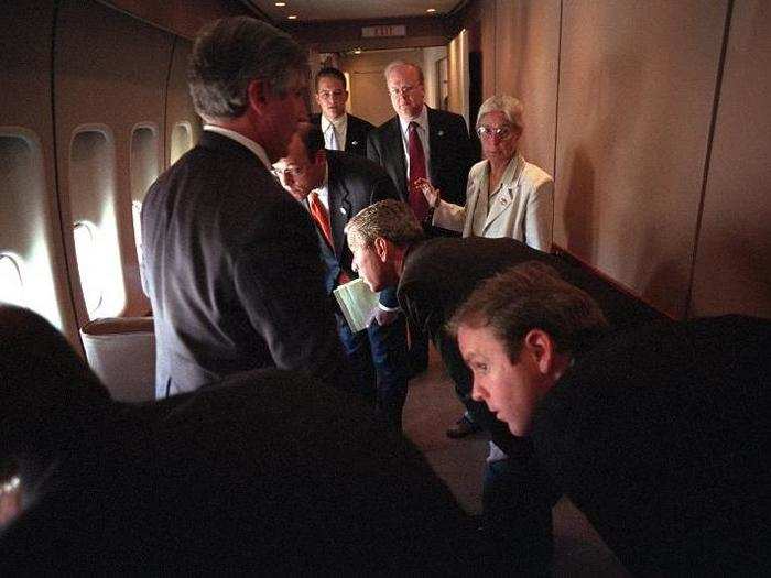 Bush and his staff look out the windows of Air Force One at their F-16 escort while en route to Barksdale Air Force Base.