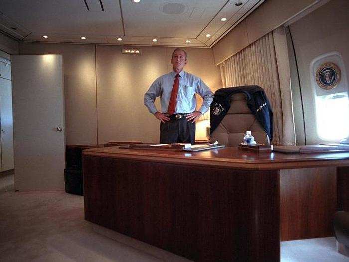 Bush watches television coverage of the terrorist attacks on the World Trade Center from his office aboard Air Force One.