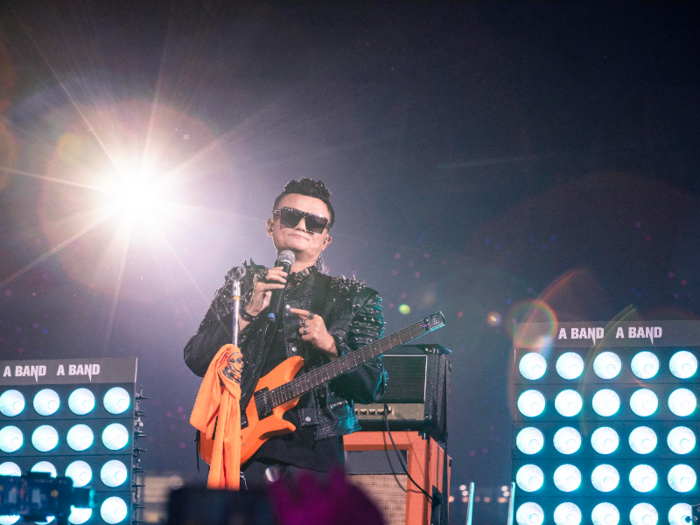 As photos from the event show, Ma played an orange guitar, wore sunglasses and spiked shoulder pads and a wig.