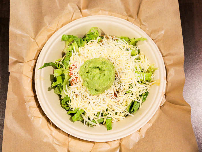 I watched in horror as my burrito bowl artist unenthusiastically slapped a pile of brisket into a bowl, followed by lackluster lettuce, pico de gallo, shredded cheese, and a spoonful of guac.