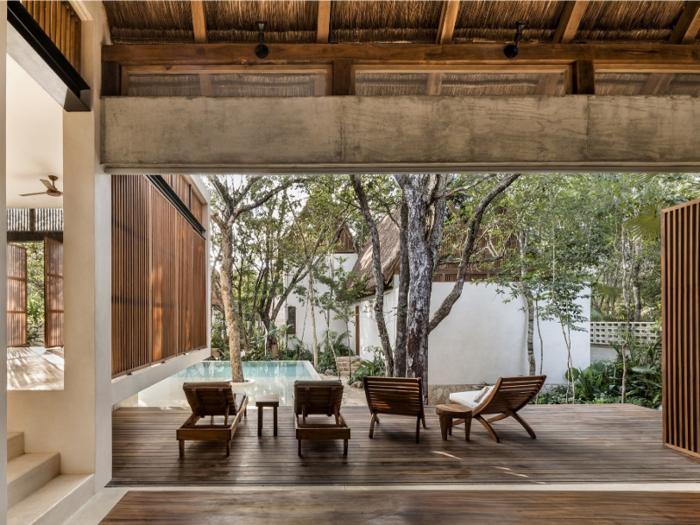 Palm leaf-lined ceilings and natural wooden finishes allow the lodges to blend in with their surroundings.