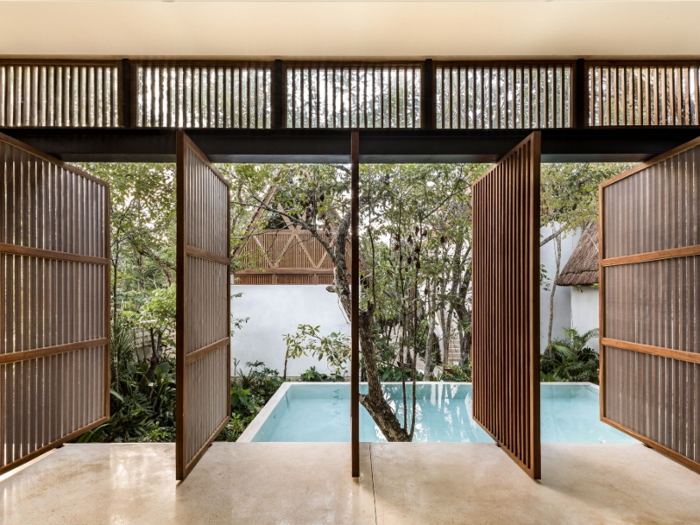 The hotel was designed by Jaque Studio with the local greenery in mind, keeping 70% of the original vegetation by constructing lodges amongst pre-existing clusters of trees.