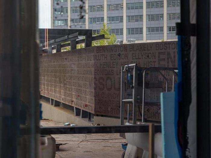 An unfinished entryway to the building has the name of every ship built in the Navy Yard written onto it.