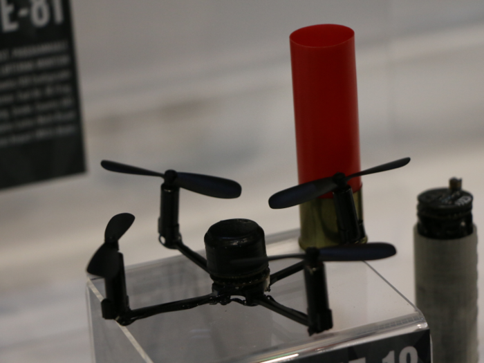 Displays ranged from ultra high-speed battlefield wiring, to this tiny drone which is folded into a shotgun cartridge and fired in the air.