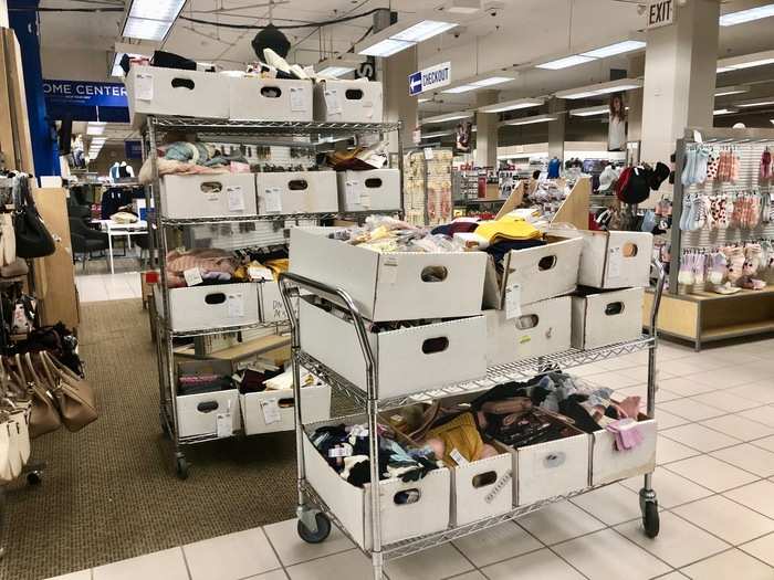 In the handbag section, we found these cardboard boxes overflowing with various trinkets and smaller accessories.