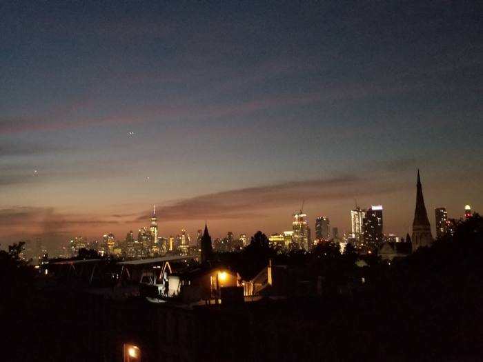 By 10 p.m., Sabatier is home. He enjoys the late summer/early fall glow over the city from the rooftop on his building. He typically finds himself here at the end of a long day.