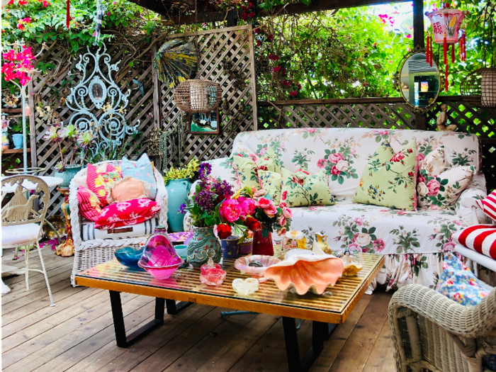 Rooms throughout the home boast lively colors and designs, including this outdoor living room.