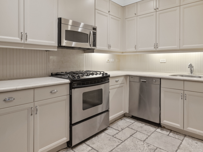 The kitchen comes equipped with custom cabinetry, Miele and Subzero appliances, a concealed washer and imported granite floors.