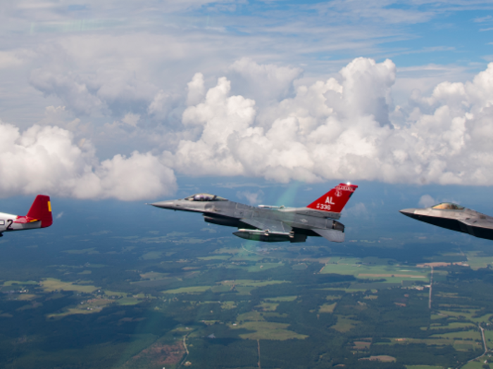 The Tuskegee Airmen also flew North American P-51 Mustangs, seen below in formation with a F-16 Fighting Falcon and F-22 Raptor.