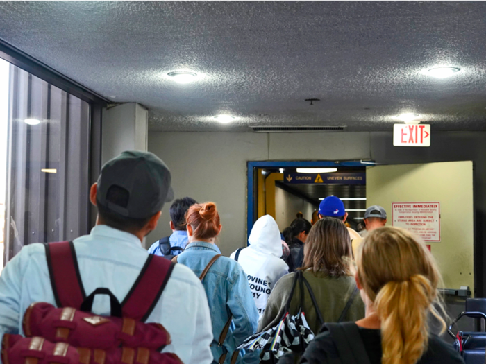 The boarding process began 30 minutes later than scheduled, so people seemed anxious about getting to their seats.