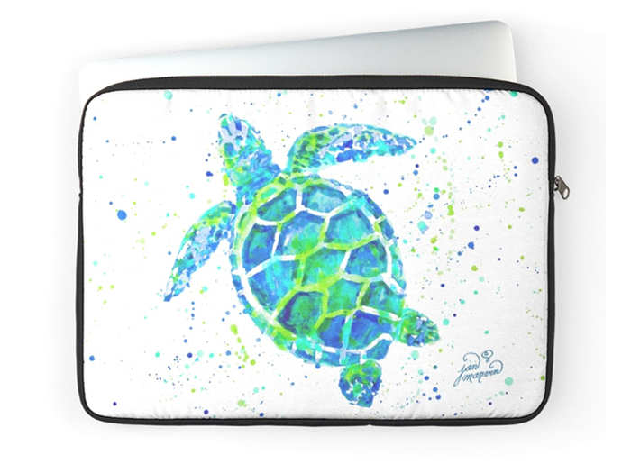 A peaceful sea turtle swimming on a laptop sleeve