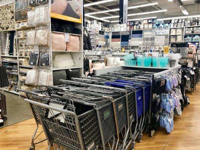 The aisles in the store were punctuated by rows of shopping carts that took up valuable walking space.