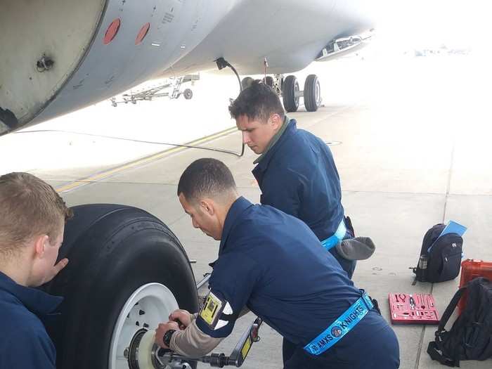 The AFRL JFWORX team has invented a new tool that allows a single airman to position and secure the spanner wrench in place, making it easier and safer to tighten the wheel. A footplate and an upright handle allow a single maintainer to apply a large axial force against the spanner wrench, keeping it seated while torque is applied.