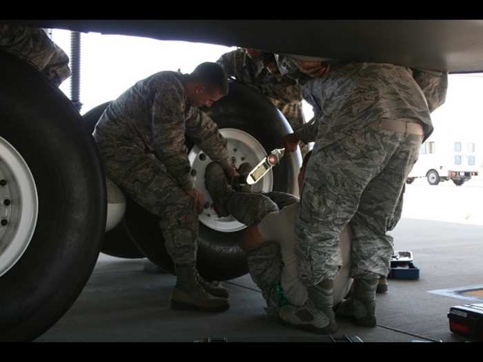 The current method of engaging the spanner wrench involves a maintainer who has to lay on the ground while pressing their feet against the wrench to hold it in place. This method can cause faulty torque readings along with placing the maintainer in an awkward and risky position underneath the heavy spanner wrench.