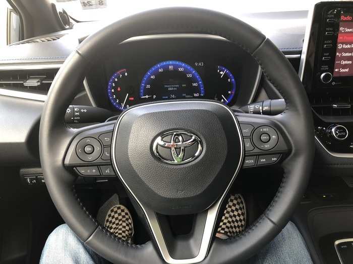 The leather-wrapped steering wheel was adorned with the usual bevy of buttons, to control numerous vehicle and infotainment functions. The gauges were old-school analog. This trim level has paddle shifters, but they were sort of useless, given the CVT transmission.