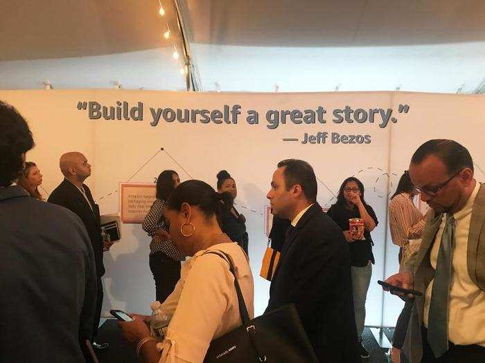 People waited in line underneath a Jeff Bezos quote to learn about Amazon.