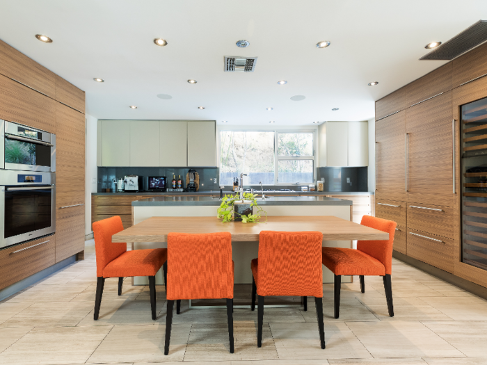 The kitchen features state-of-the-art appliances, including a climate-controlled wine cellar.