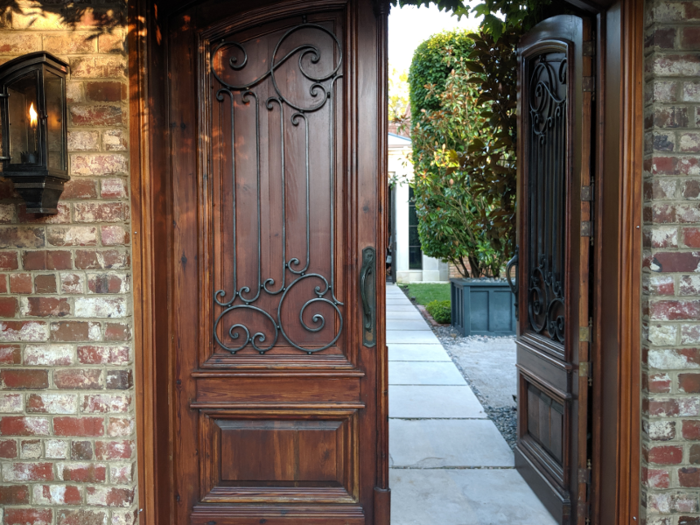 After handing off my car keys to the valet, I walked through a pair of ornate wooden double doors into a courtyard, where a couple of staffers were checking people in from the guest list.