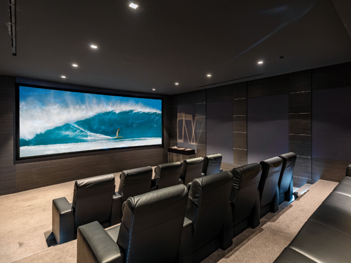 The in-home movie theater can seat at least 15 people.