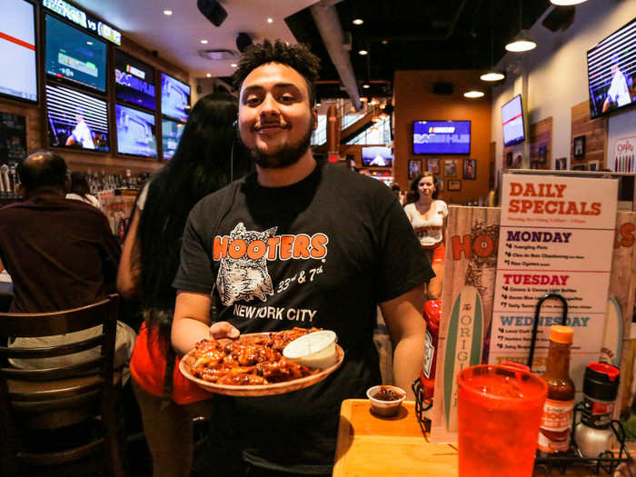 When my wings finally did arrive, they were served by a guy wearing a black logo tee. He wasn