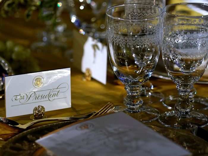 Golden champagne grapes (which you can see here on the left) will be on each table, too, "highlighting the richness of each of the countries