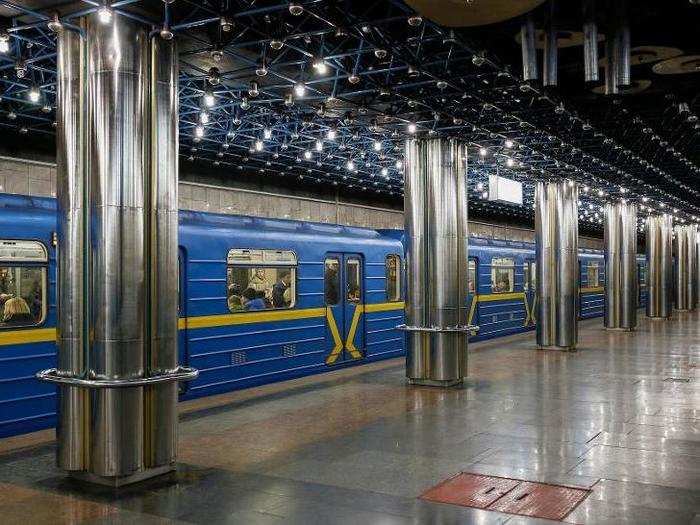 Some stations are dark and sleek, with modern lighting fixtures. Slavutych features these industrial-chic pillars.