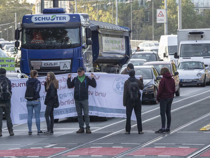 The protests are now spreading into Europe as the school and work day begins. Here, demonstrators block traffic in Frankfurt, Germany.