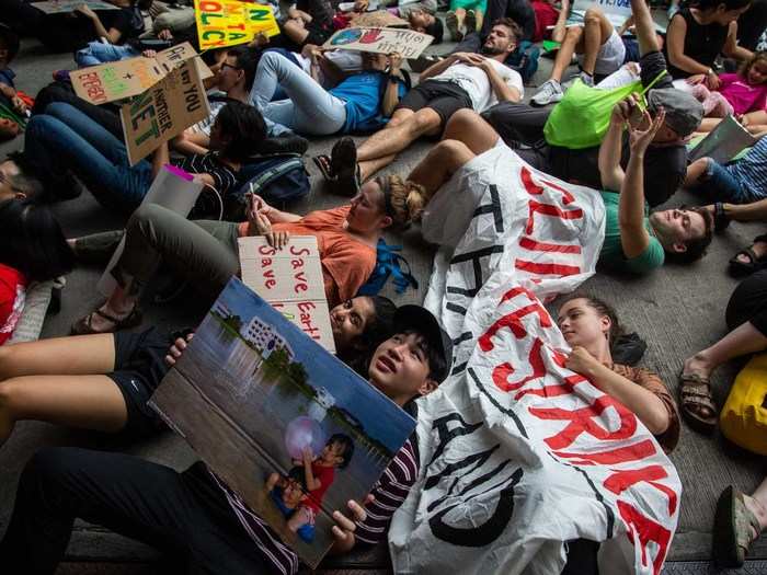 They staged a "die-in," an attempt to symbolize the consequences of climate change. They also delivered a letter to the government calling on it to declare a climate emergency and phase out coal.