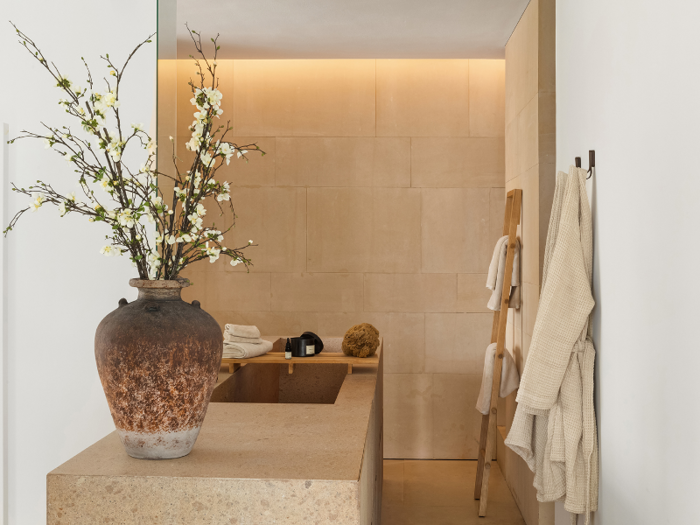 The master bath uses the same stone as the kitchen.