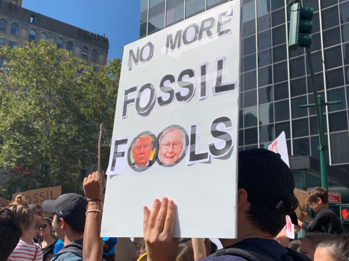 Others blamed politicians, like this sign featuring President Trump and Senate Majority Leader Mitch McConnell.