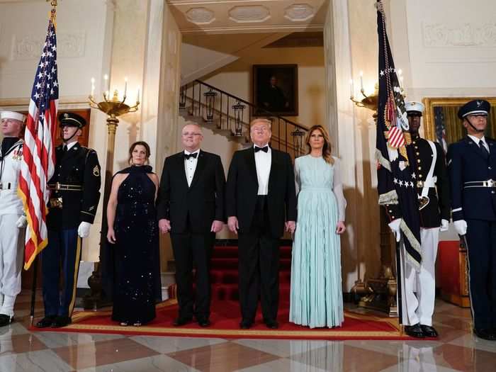 Members of the armed forces were on hand with flags and instruments to participate in the formal welcoming ceremonies, seen here in the Grand Foyer of the White House.