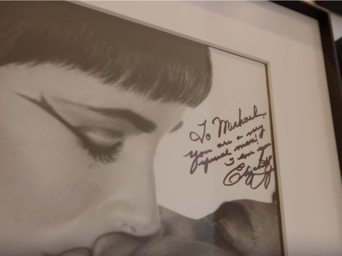 His collection even includes a signed photo of Elizabeth Taylor.