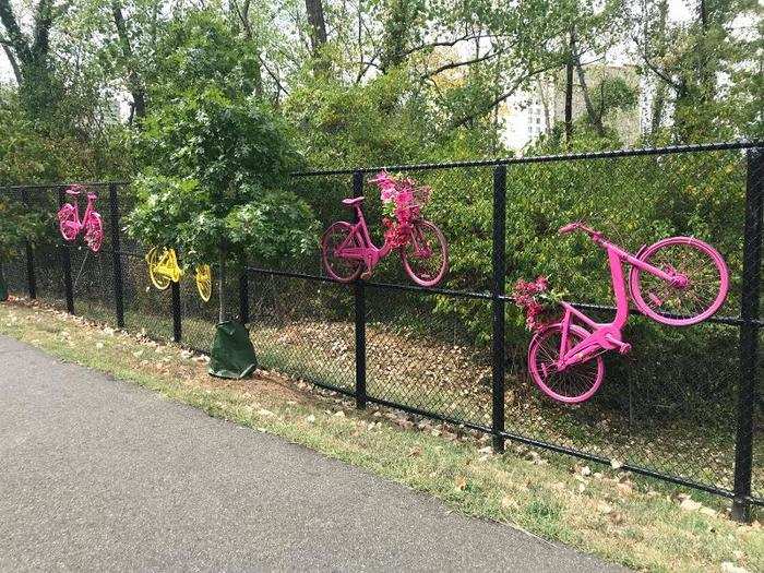 As we walked around, we saw several of the painted bicycles hanging along a fence ...